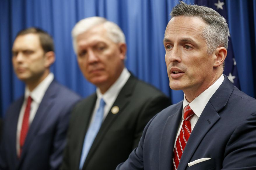 Tim Garrison, right, United States Attorney for the Western District of Missouri, speaks during a press conference on Thursday, Nov. 8, 2018 in Springfield, Mo., about the indictments against Kenneth Scott McKee, the captain of a duck boat that sank on Table Rock Lake in July, killing 17 people. (Andrew Jansen/The Springfield News-Leader via AP)