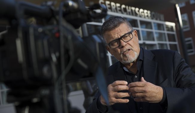 Self-styled Dutch positivity guru Emile Ratelband answers questions during an interview in Utrecht, Netherlands, Thursday, Nov. 8, 2018. For Ratelband age really is just a number. In a legal battle that is stretching the debate about just how far a person can go in changing his or her identity, the sixty-nine-year-old television personality has asked a Dutch court to officially change his biological date of birth to make him 49. (AP Photo/Peter Dejong)