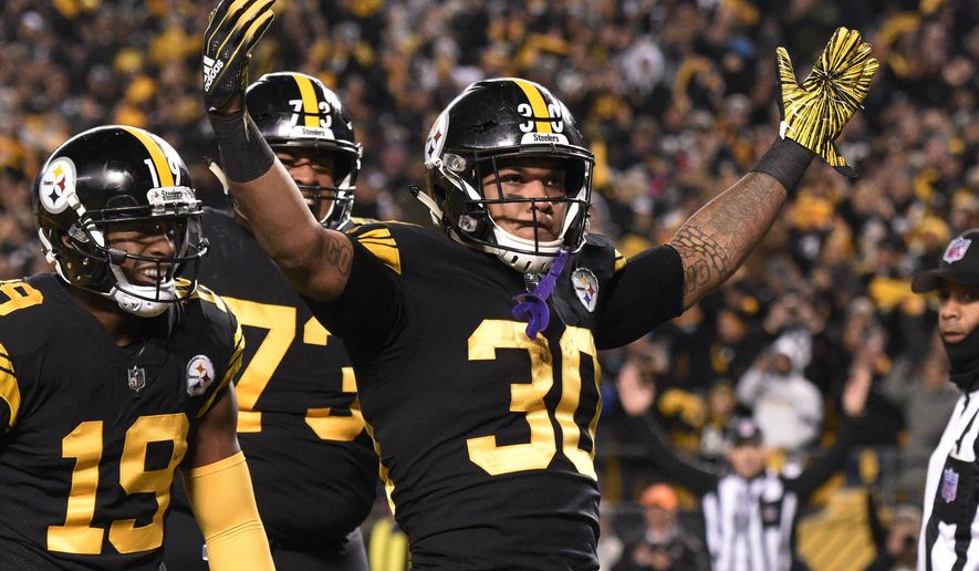 Pittsburgh Steelers running back James Conner (30) celebrates his touchdown against the Carolina Panthers during the first half of an NFL football game in Pittsburgh, Thursday, Nov. 8, 2018. (AP Photo/Don Wright)