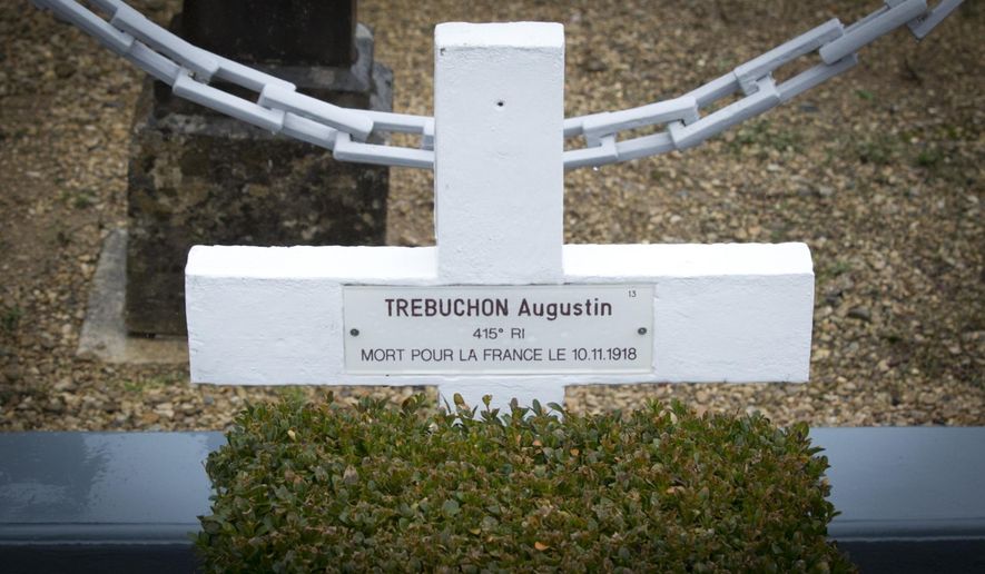 In this photo taken on Tuesday, Oct. 30, 2018, the grave marker of French WWI soldier Augustin Trebuchon in Vrigne-Meuse, France. His tiny plot is almost on the front line where the guns finally fell silent at 11 a.m. on the 11th day of the 11th month in 1918, after a four-year war that had already killed millions. Hundreds of troops died on the final morning of World War I _ even after an armistice was reached and before it came into force. Death at literally the 11th hour highlighted the futility of a conflict that had become even more incomprehensible in four years of battle. (AP Photo/Virginia Mayo)