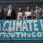 In this July 18, 2018, photo, lawyers and youth plaintiffs lineup behind a banner after a hearing before Federal District Court Judge Ann Aiken between lawyers for the Trump Administration and the so-called Climate Kids in Federal Court in Eugene, Ore. The lawsuit against the U.S. government for being slow to address climate change is on hold again, after a federal appeals court Thursday, Nov. 8, 2018, granted the Trump administration&#x27;s motion for a temporary stay. The constitutional climate lawsuit was brought by 21 young Americans and is supported by Our Children&#x27;s Trust. (Chris Pietsch/The Register-Guard via AP) **FILE**