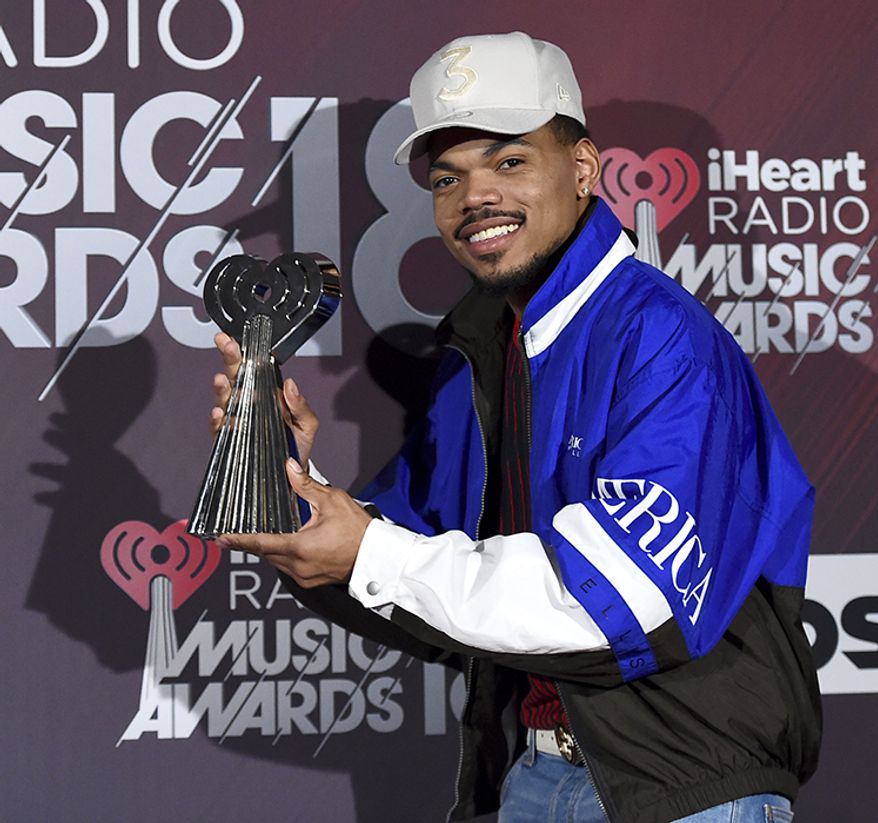 12. Chance the Rapper, 25, $33 million
Chance the Rapper poses in the press room with the Innovator of the Year award at the iHeartRadio Music Awards at The Forum on Sunday, March 11, 2018, in Inglewood, Calif. (Photo by Jordan Strauss/Invision/AP)