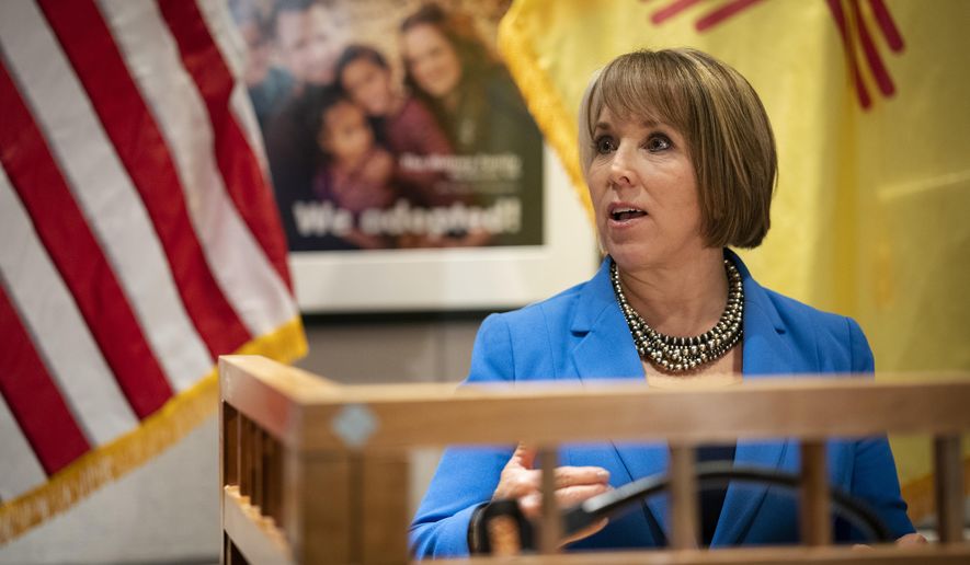 U.S. Rep. Michelle Lujan Grisham, who was elected Tuesday as the state's next governor, answers questions at a joint press conference with New Mexico Gov. Susana Martinez at the State Capitol in Santa Fe, N.M., on Friday, Nov. 9, 2018. Martinez, a Republican and the state's first female governor, has served two consecutive terms. Lujan Grisham, a Democrat, will take office Jan. 1, 2019. (AP Photo/Craig Fritz)