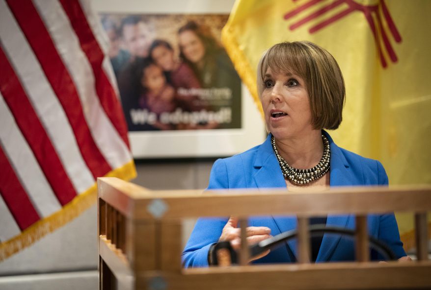 U.S. Rep. Michelle Lujan Grisham, who was elected Tuesday as the state's next governor, answers questions at a joint press conference with New Mexico Gov. Susana Martinez at the State Capitol in Santa Fe, N.M., on Friday, Nov. 9, 2018. Martinez, a Republican and the state's first female governor, has served two consecutive terms. Lujan Grisham, a Democrat, will take office Jan. 1, 2019. (AP Photo/Craig Fritz)
