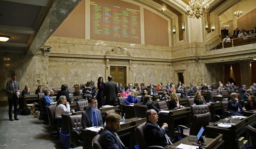 In this June 30, 2017 file photo, voting results are projected above the House floor of the Washington Legislature at the Capitol in Olympia, Wash. (AP Photo/Ted S. Warren, File) **FILE**