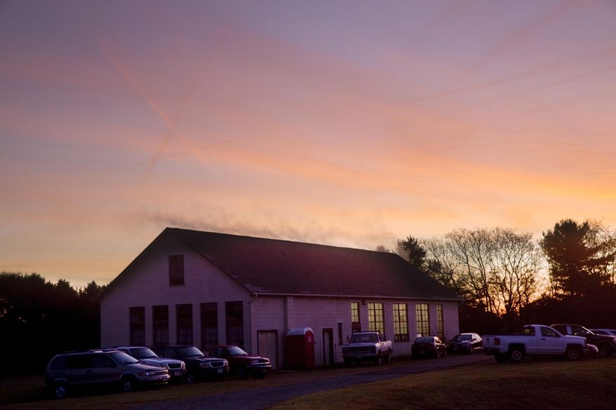This photo taken Oct. 25, 2018, shows the sun rising over the Glade Hill Cannery in Franklin County, Va. (Stephanie Klein Davis /The Roanoke Times via AP)