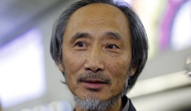 In this Nov. 9, 2018, photo, Chinese dissident writer Ma Jian speaks to media after arriving Hong Kong international airport. Concerns have been raised about freedom of expression in Hong Kong following the cancellation of literary and artistic events and the refusal to allow a Financial Times editor to enter the semi-autonomous Chinese territory. The author Ma Jian is still planning to enter the city amid plans to arrange an alternative venue, while Chinese-Australian artist Badiucao’s show was called-off after alleged threats from Chinese authorities. Financial Times’ Victor Mallet was turned around at the airport. (AP Photo/Kin Cheung)