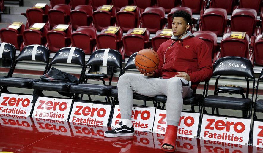 Injured Iowa State guard Lindell Wigginton sits on the bench before an NCAA college basketball game against Missouri, Friday, Nov. 9, 2018, in Ames, Iowa. (AP Photo/Charlie Neibergall)