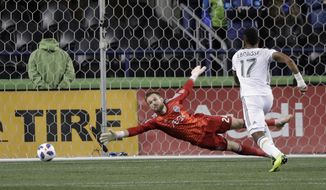Seattle Sounders goalkeeper Stefan Frei, left can&#39;t get to the ball on a goal by Portland Timbers midfielder Sebastian Blanco, not seen, as Timbers&#39; Jeremy Ebobisse (17) watches during the second half of a second-leg MLS playoff soccer match Thursday, Nov. 8, 2018, in Seattle. (AP Photo/Ted S. Warren)