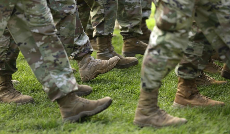 FILE- In this April 3, 2017, file photo U.S. Army soldiers march in formation during a change of command ceremony at Joint Base Lewis-McChord in Washington. If you’re a veteran with student debt, you have repayment rights unique to military service members that can keep you on track and out of default. (AP Photo/Ted S. Warren, File)