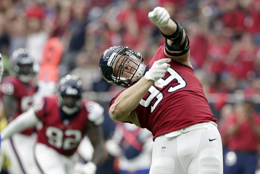 FILE - In this Oct. 14, 2018, file photo, Houston Texans defensive end J.J. Watt (99) celebrates after he sacked Buffalo Bills quarterback Josh Allen during the first half of an NFL football game in Houston. Halfway through the season, Watt is both a defensive player of the year and comeback player of the year candidate. (AP Photo/Michael Wyke, FIle)