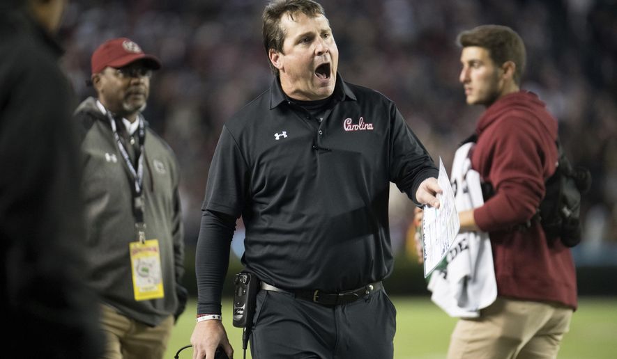 FILE - In this Oct. 27, 2018, file photo, South Carolina head coach Will Muschamp, center, shouts at an official during the second half of an NCAA college football game against Tennessee in Columbia, S.C. Facing former Florida coach Will Muschamp is the least of Dan Mullen’s concerns. Mullen and the 19th-ranked Gators have a two-game losing streak and plenty of chaos, especially at quarterback. (AP Photo/Sean Rayford, File)