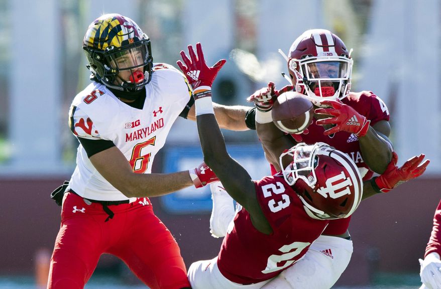 Indiana defensive back Jaylin Williams (23) and defensive back Marcelino Ball (42) battle to grab a pass intended for Maryland wide receiver Jeshaun Jones (6) during the first half of an NCAA college football game Saturday, Nov. 10, 2018, in Bloomington, Ind. (AP Photo/Doug McSchooler) ** FILE **