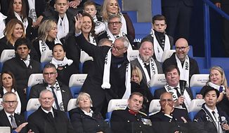 Former Leicester City Manager Claudio Ranieri, center, in the stands during the English Premier League soccer match between Leicester City and Burnley at the King Power stadium, Leicester, England. Saturday Nov. 10 2018 (Joe Giddens/PA via AP)