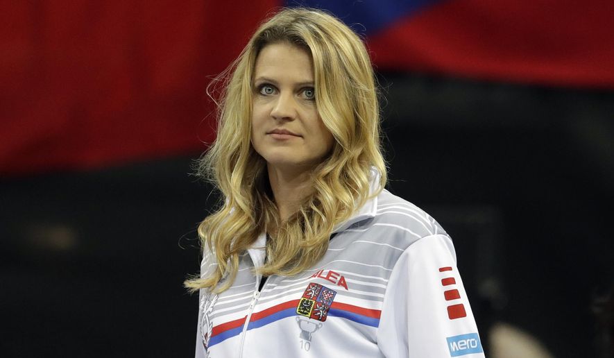 Tennis player Lucie Safarova of the Czech Republic watches a tennis match of the Fed Cup Final between Czech Republic and United States in Prague, Czech Republic, Saturday, Nov. 10, 2018. Former French Open finalist Lucie Safarova said on Saturday that she is planning to retire after the Australian Open. (AP Photo/Petr David Josek)
