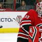 Carolina Hurricanes goaltender Scott Darling eyes the puck as it hits the post during the second period of the team&#39;s NHL hockey game against the Detroit Red Wings, Saturday, Nov. 10, 2018, in Raleigh, N.C. (AP Photo/Karl B DeBlaker)