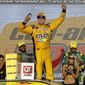 Kyle Busch (18) celebrates after winning a NASCAR Cup Series auto race on Sunday, Nov. 11, 2018, in Avondale, Ariz. (AP Photo/Rick Scuteri)