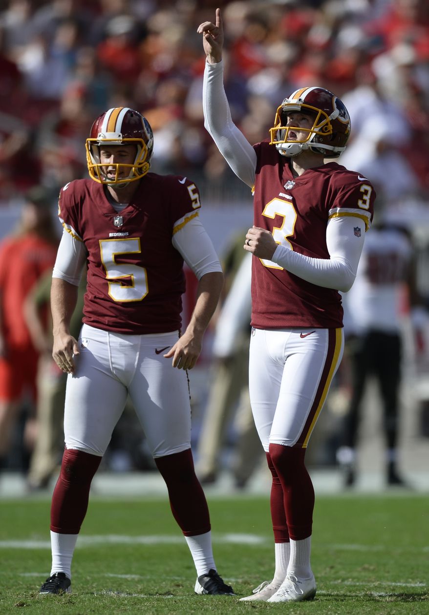 Washington Redskins kicker Dustin Hopkins (3) celebrates his field goal against the Tampa Bay Buccaneers as holder Tress Way (5) looks on during the first half of an NFL football game Sunday, Nov. 11, 2018, in Tampa, Fla. (AP Photo/Jason Behnken)