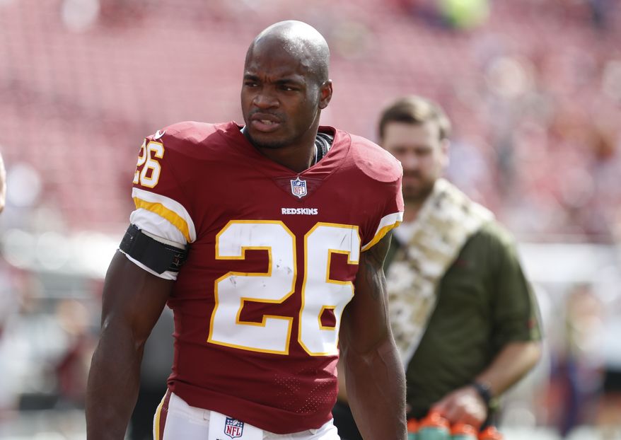 Washington Redskins running back Adrian Peterson (26) before an NFL football game against the Tampa Bay Buccaneers Sunday, Nov. 11, 2018, in Tampa, Fla. (AP Photo/Mark LoMoglio) ** FILE **