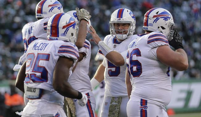 Buffalo Bills quarterback Matt Barkley (5) celebrates with teammates after the Bills scored a touchdown against the New York Jets during the third quarter of an NFL football game, Sunday, Nov. 11, 2018, in East Rutherford, N.J. (AP Photo/Seth Wenig)