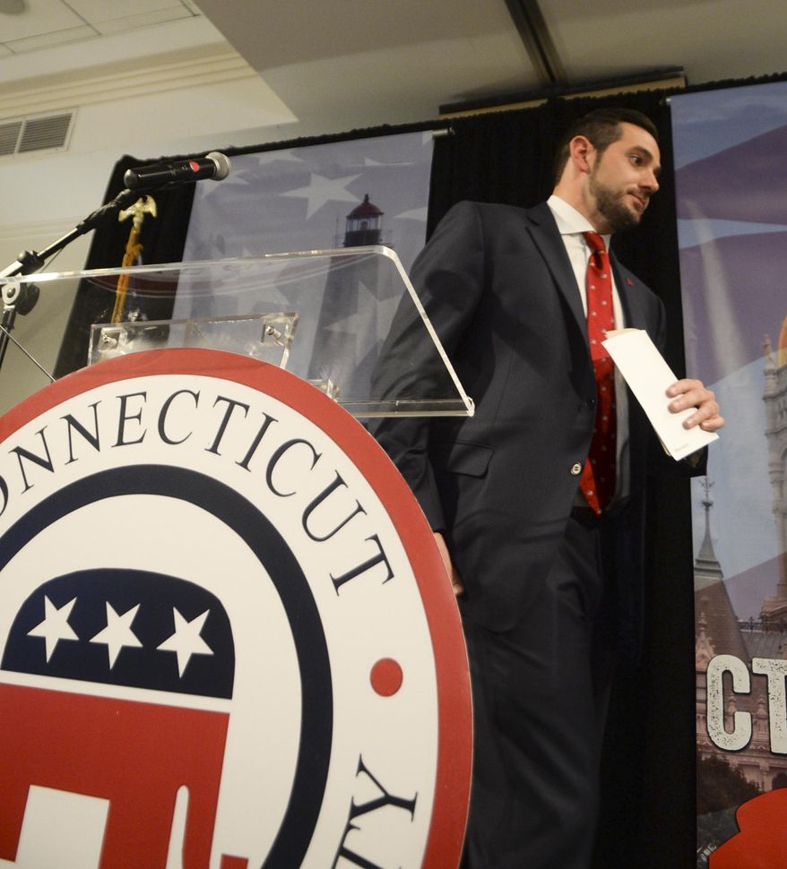 J.R. Romano, Connecticut GOP Chairman, calls it a night at 1:35 a.m. with no decision in the Connecticut gubernatorial race at the Bob Stefanowski campaign gathering Wednesday, Nov. 7, 2018 in Rocky Hill, Conn. (AP Photo/Stephen Dunn)