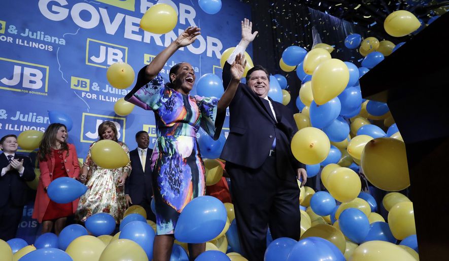 FILE - In this Tuesday, Nov. 6, 2018, file photo, Democratic gubernatorial candidate J.B. Pritzker, right, and his running mate Lt. Governor candidate Juliana Stratton celebrate as they wave to supporters after they won over Republican incumbent Bruce Rauner in Chicago. Democrats who gained new or expanded powers in state elections are gearing up for a left-leaning push on gun control, universal health care and legal marijuana. Meanwhile, some Republican legislatures that have cut taxes and limited union powers are adjusting to a new reality of needing to work with a Democratic governor. The midterm elections Tuesday, Nov. 6, increased Democratic relevance in state capitols that have been dominated by Republicans during the past decade. (AP Photo/Nam Y. Huh, File)