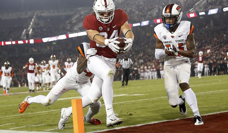 Stanford tight end Colby Parkinson (84) scores a touchdown past Oregon State safety Jeffrey Manning Jr. (15) in the first half during an NCAA college football game on Saturday, Nov. 10, 2018, in Stanford, Calif. (AP Photo/Tony Avelar)