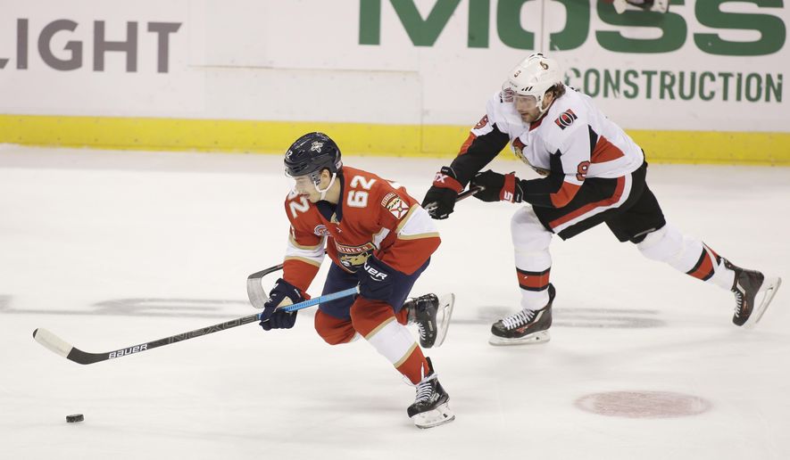 Florida Panthers center Denis Malgin (62) defends against Ottawa Senators right wing Bobby Ryan (9) during the first period of an NHL hockey game on Sunday, Nov. 11, 2018 in Sunrise, Fla. (AP Photo/Terry Renna)
