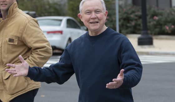 Jeff Sessions, ousted last week from his job as attorney general by President Donald Trump, smiles as he exercises during a brisk walk across the grounds of the U.S. Capitol where he served for 20 years as a Republican senator from Alabama, in Washington, Monday, Nov. 12, 2018. (AP Photo/J. Scott Applewhite)
