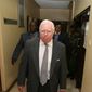 Jerome Corsi, who wrote &quot;The Obama Nation: Leftist Politics and the Cult of Personality, walks down a corridor Tuesday, Oct. 7, 2008 as he arrives at the immigration department in Nairobi, Kenya.  Corsi, was picked up at his hotel in Nairobi on Tuesday morning. He was briefly detained before being brought to the airport for deportation, said Joseph Mumira, head of criminal investigations at Jomo Kenyatta International Airport. (AP Photo) **  KENYA OUT **