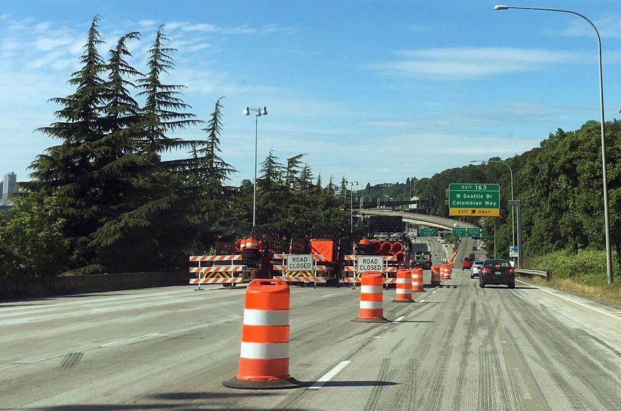 Northbound Interstate 5 south of Seattle is shown closed at the West Seattle Bridge exit, Saturday, June 2, 2018, in Seattle. The Washington State Dept. of Transportation and its contractors shut down the freeway from the bridge exit to the Olive Way exit in downtown Seattle from Friday night through early Monday morning to complete major repair and renovation work on the roadway. Lane closures south of the full closure added to congestion and drivers were encouraged to use alternate routes. (AP Photo/Ted S. Warren)