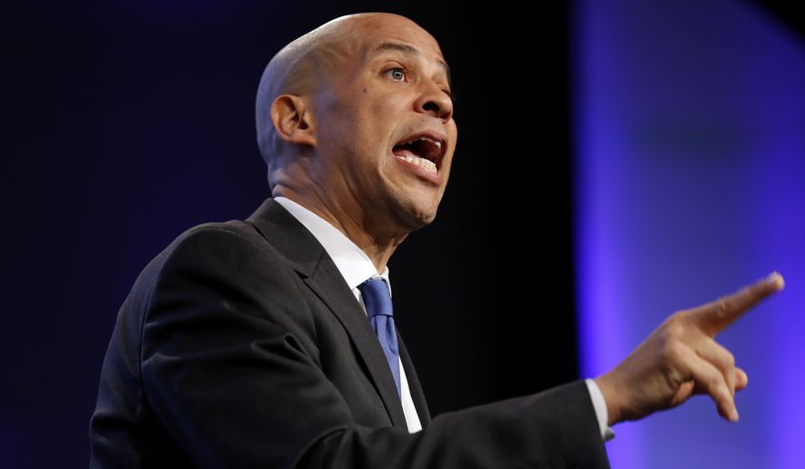 In this Oct. 6, 2018 photo, Sen. Cory Booker, D-N.J., speaks during the Iowa Democratic Party's annual Fall Gala, in Des Moines, Iowa. Booker is telling students on a historically black campus in the early presidential voting state of South Carolina that apathetic voters rather than Republicans are to blame for the nation’s problems. (AP Photo/Charlie Neibergall)