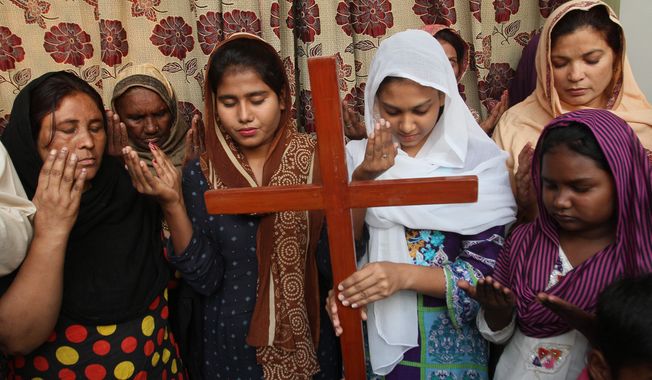 Pakistan Christians pray for Asia Bibi, a Catholic mother of five who has been on death row since 2010 accused of blasphemy in Multan, Pakistan. Wednesday, Oct. 31, 2018. Pakistan&#x27;s top court on Wednesday acquitted Bibi who was sentenced to death under the country&#x27;s controversial blasphemy law, a landmark ruling that sparked protests by hard-line Islamists and raised fears of violence. (AP Photo/Irum Asim)