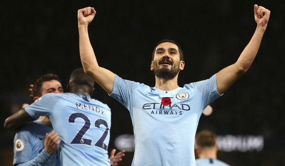 Manchester City&#39;s Ilkay Gundogan celebrates after scoring his side&#39;s third goal during the English Premier League soccer match between Manchester City and Manchester United at the Etihad stadium in Manchester, England, Sunday, Nov. 11, 2018. (AP Photo/Dave Thompson)