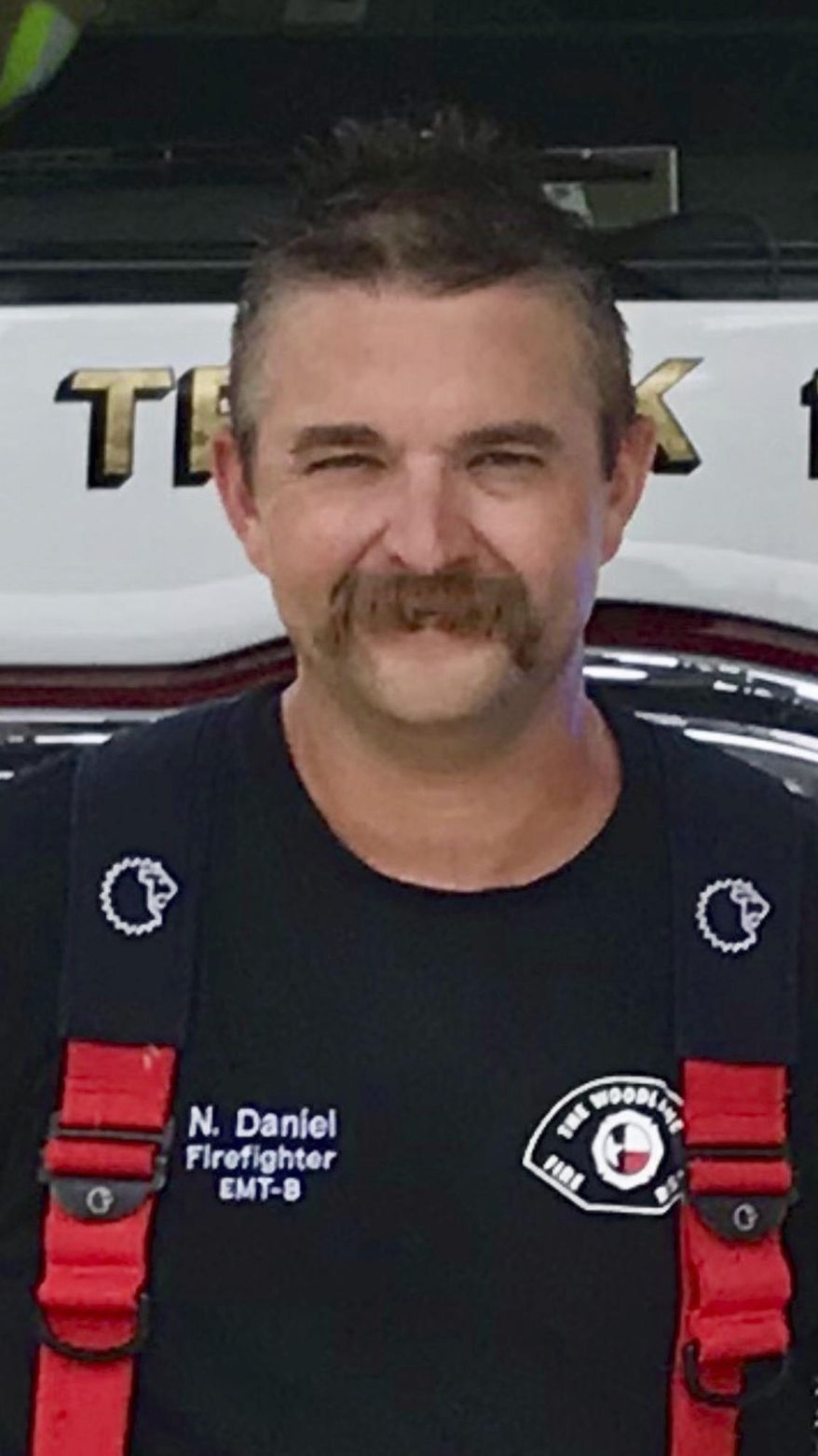 This file photo provided by The Woodlands Fire Department shows firefighter Nicholas Daniel. Investigators say a Houston-area homeowner fatally shot Daniel after both attended a party and later got into a physical fight. The Montgomery County Sheriff's Office says Daniel was shot during an altercation Sunday in Montgomery and the shooting will be referred to a grand jury. A statement Monday, Nov. 12, 2018, on behalf of The Woodlands Fire Department says the 38-year-old Daniel was hired in 2015 and wasn't on duty when shot. (The Woodlands Fire Department via AP)