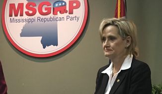 Republican U.S. Sen. Cindy Hyde-Smith of Mississippi appeared at a news conference at the state Republican Party headquarters in Jackson, Miss., on Monday, Nov. 12, 2018, and said repeatedly that she would not answer questions about a video that showed her at a Nov. 2 campaign event in Tupelo, Miss., where she praised a man by saying: &amp;quot;If he invited me to a public hanging, I&#x27;d be on the front row.&amp;quot; Hyde-Smith issued a statement Sunday saying the remark was &amp;quot;an exaggerated expression of regard&amp;quot; for a friend who invited her to speak, and &amp;quot;any attempt to turn this into a negative connotation is ridiculous.&amp;quot; (AP Photo/Emily Wagster Pettus) ** FILE **