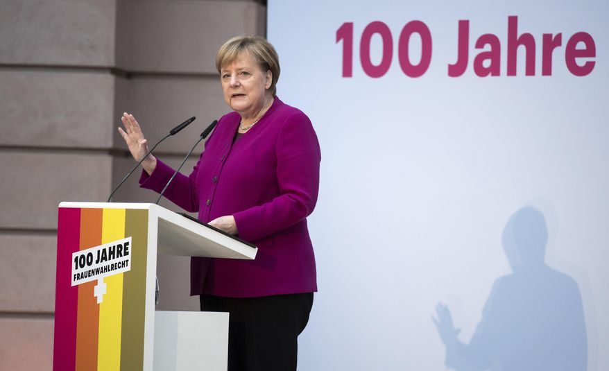 German Chancellor Angela Merkel speaks at an event marking 100 years of voting rights for women in Germany in Berlin, Monday, Nov. 12, 2018. (Bernd von Jutrczenka/dpa via AP)