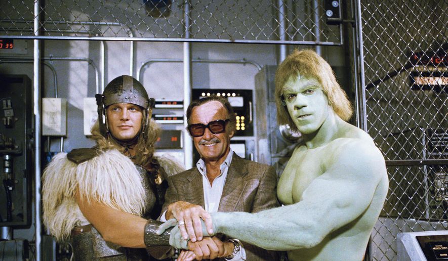 In this May 9, 1988, file photo, comics impresario Stan Lee, center, poses with Lou Ferrigno, right, and Eric Kramer who portray &quot;The Incredible Hulk&quot; and Thor, respectively, in a special movie for NBC, &quot;The Incredible Hulk Returns,&quot; May 9, 1988, Los Angeles, Calif. (AP Photo/Nick Ut, File)