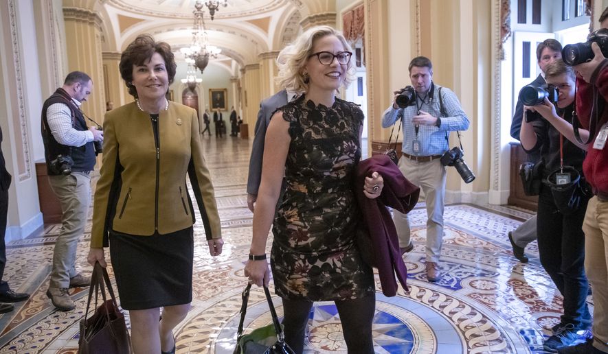 Newly elected Democratic Senators Jacky Rosen of Nevada, left, and Kyrsten Sinema of Arizona, arrive at the Capitol in Washington for a meeting with Senate Minority Leader Chuck Schumer, D-N.Y., Tuesday, Nov. 13, 201816. (AP Photo/J. Scott Applewhite)