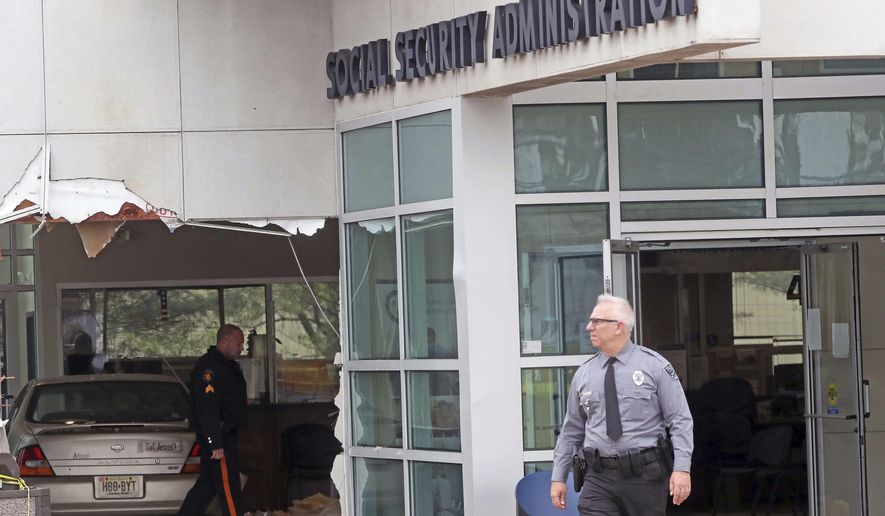 A car has crashed into a Social Security office, Tuesday, Nov. 13, 2018 in Egg Harbor, N.J. Police say the driver was attempting to park when the car crashed into the building, entering a lobby where many people were waiting. It wasn't immediately clear how serious the injuries were, though officials say a female passenger in the vehicle appeared to be critically hurt. Two children also were in the vehicle but they appeared to escape serious injury. (Craig Matthews/The Press of Atlantic City via AP)