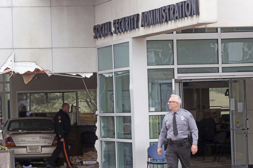 A car has crashed into a Social Security office, Tuesday, Nov. 13, 2018 in Egg Harbor, N.J. Police say the driver was attempting to park when the car crashed into the building, entering a lobby where many people were waiting. It wasn't immediately clear how serious the injuries were, though officials say a female passenger in the vehicle appeared to be critically hurt. Two children also were in the vehicle but they appeared to escape serious injury. (Craig Matthews/The Press of Atlantic City via AP)