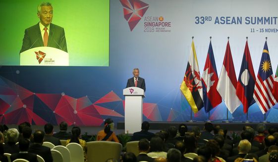 Singapore&#39;s Prime Minister Lee Hsien Loong addresses delegates during the opening ceremony for the 33rd ASEAN Summit and Related Summits Tuesday, Nov. 13, 2018, in Singapore. The summit is expected to discuss the South China Sea issue, maritime security and terrorism. (AP Photo/Bullit Marquez)