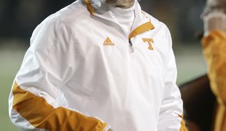 FILE - In this Nov. 17, 2012, file photo, Tennessee head coach Derek Dooley walks the sideline in an NCAA college football game against Vanderbilt in Nashville, Tenn. Dooley, now offensive coordinator at Missouri, says he has no hard feelings toward Tennessee as he prepares for his return to Knoxville. Missouri plays Tennessee on Saturday, Nov. 17, 2018.(AP Photo/Mark Humphrey, File)