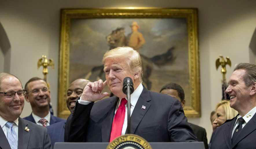 President Donald Trump points to his ear and says &quot;Did I hear the word bipartisan?&quot; as he announces his support for H. R. 5682, the &quot;First Step Act&quot; as bipartisan legislation during a speech in the Roosevelt Room of the White House in Washington, Wednesday, Nov. 14, 2018, which would reform America&#39;s prison system. (AP Photo/Andrew Harnik)