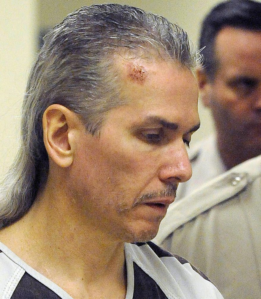 FILE - In this April 13, 2011 file photo, Rodney Berget, who was convicted of killing a Sioux Falls prison guard during an escape attempt, is escorted to court in Sioux Falls, S.D. A transcript from the Oct. 29, 2018, execution of Berget shows his last words were: "Is it supposed to feel like that?" Berget's attorneys weren't immediately available to comment Wednesday, Nov. 14. (Elisha Page /The Argus Leader via AP, File)