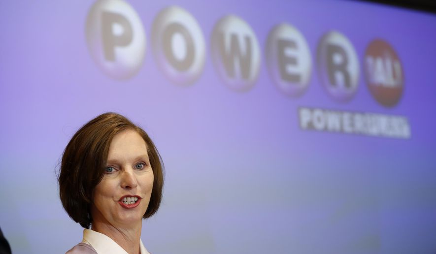 FILE - In this Nov. 5, 2018, file photo, Lerynne West, of Redfield, Iowa, speaks to the media after arriving in Clive, Iowa, to claim her share of a nearly $700 million Powerball prize. West announced on the Ellen Lee DeGeneres show broadcast Wednesday, Nov. 14, 2018, that she has donated $500,000 to the Travis Mills Foundation, a Maine-based organization that offers programs for disabled veterans. (AP Photo/Charlie Neibergall, File)