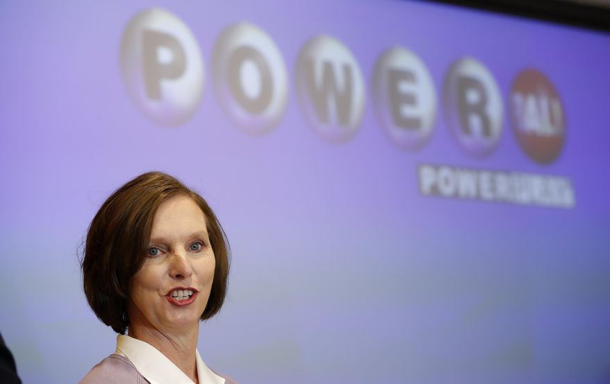 FILE - In this Nov. 5, 2018, file photo, Lerynne West, of Redfield, Iowa, speaks to the media after arriving in Clive, Iowa, to claim her share of a nearly $700 million Powerball prize. West announced on the Ellen Lee DeGeneres show broadcast Wednesday, Nov. 14, 2018, that she has donated $500,000 to the Travis Mills Foundation, a Maine-based organization that offers programs for disabled veterans. (AP Photo/Charlie Neibergall, File)
