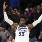 Newly acquired Minnesota Timberwolves&#39; Robert Covington encourages the crowd in the final moments of an NBA basketball game against the New Orleans Pelicans Wednesday, Nov. 14, 2018, in Minneapolis. The Timberwolves won 107-100. (AP Photo/Jim Mone)