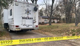 FILE - In this Oct. 23, 2018, file photo, a Barron County, Wis., sheriff&#x27;s vehicle is parked outside the home where James Closs and Denise Closs were found fatally shot on Oct. 15. A search to find the couple&#x27;s missing 13-year-old daughter Jayme continues. The FBI is examining additional surveillance video taken from an expanded area around the home. Investigators believe Jayme was abducted. (AP Photo/Jeff Baenen, File)