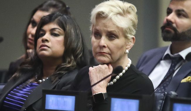 Cindy McCain, second from right, co-chair of the McCain Institute&#x27;s Human Trafficking Advisory Council, and trafficking survivor Rani Hong, second from left, listen after addressing the human rights conference, &quot;Stepping Up Action to End Forced Labour, Modern Slavery and Human Trafficking,&quot; during the United Nations General Assembly, Monday Sept. 24, 2018, at U.N. headquarters. (AP Photo/Bebeto Matthews) ** FILE **